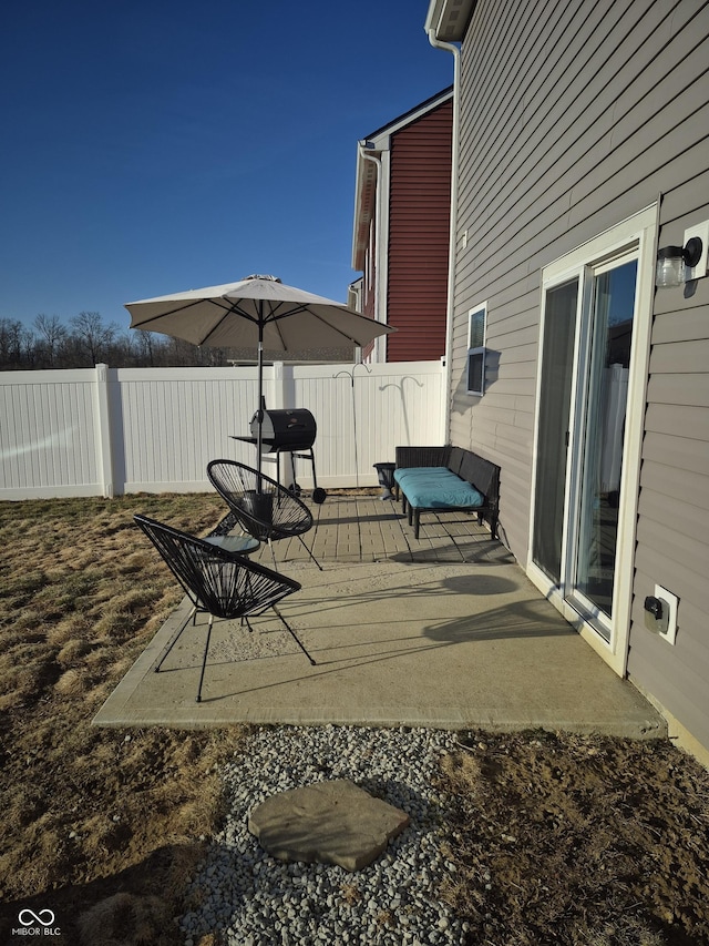 view of patio / terrace featuring fence and a wooden deck