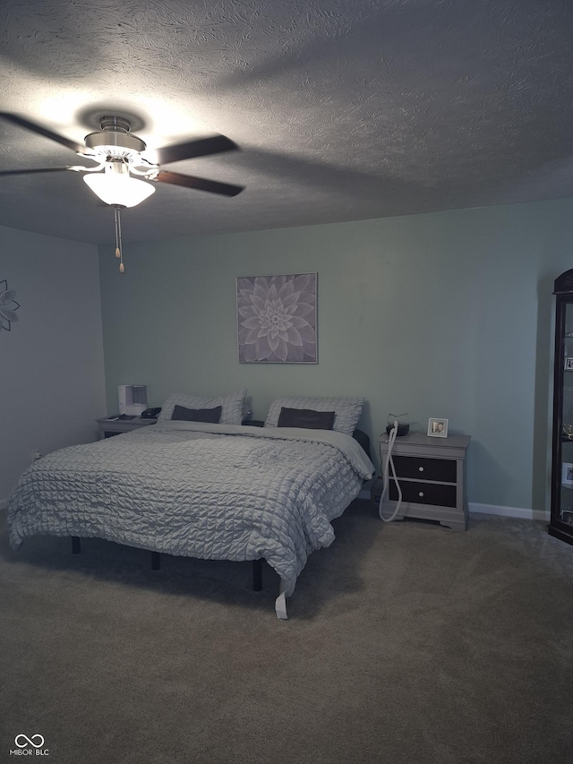 bedroom with carpet, a ceiling fan, and a textured ceiling