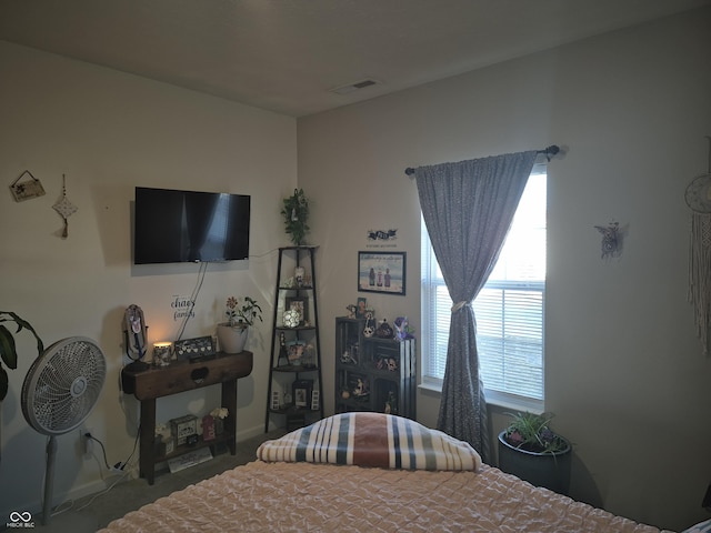 bedroom featuring visible vents