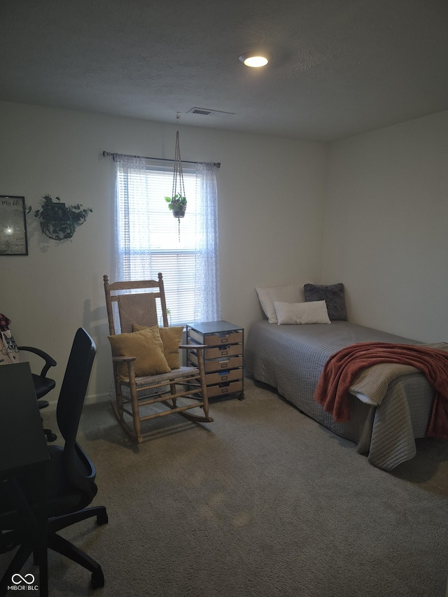 carpeted bedroom with visible vents