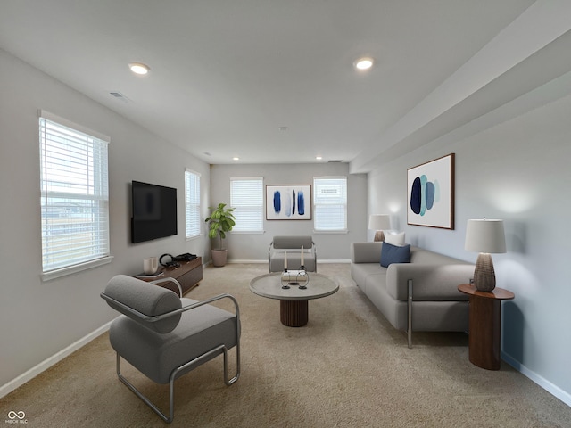 living area with carpet floors, visible vents, baseboards, and recessed lighting