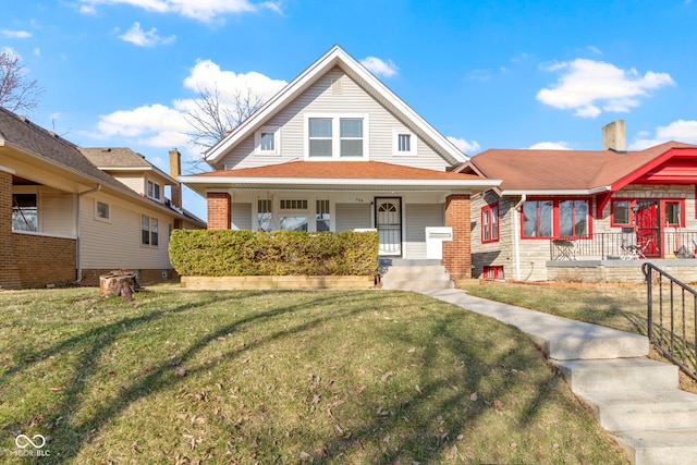 bungalow-style house with covered porch and a front yard