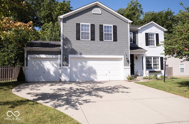 traditional-style home featuring an attached garage, brick siding, fence, concrete driveway, and a front yard