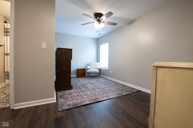 unfurnished room featuring ceiling fan, baseboards, and wood finished floors