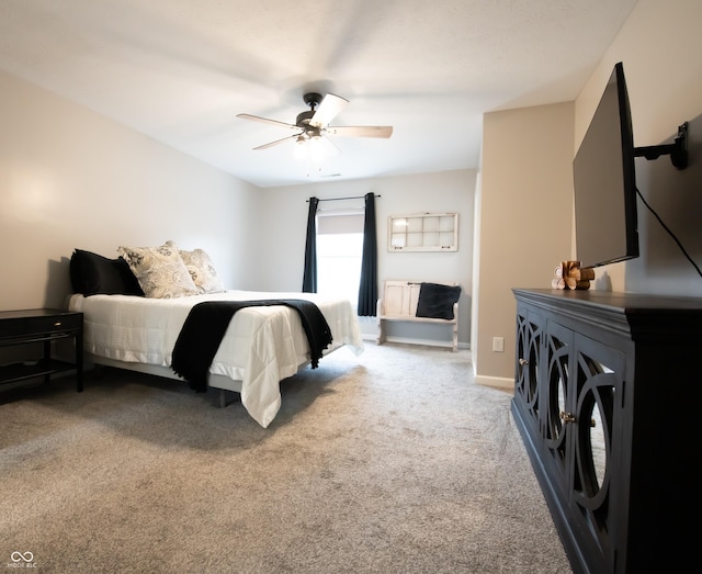 bedroom with carpet, a ceiling fan, and baseboards