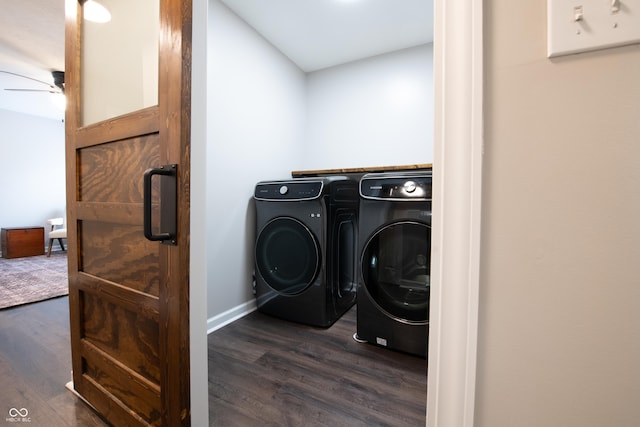 clothes washing area with ceiling fan, laundry area, washing machine and clothes dryer, and dark wood finished floors