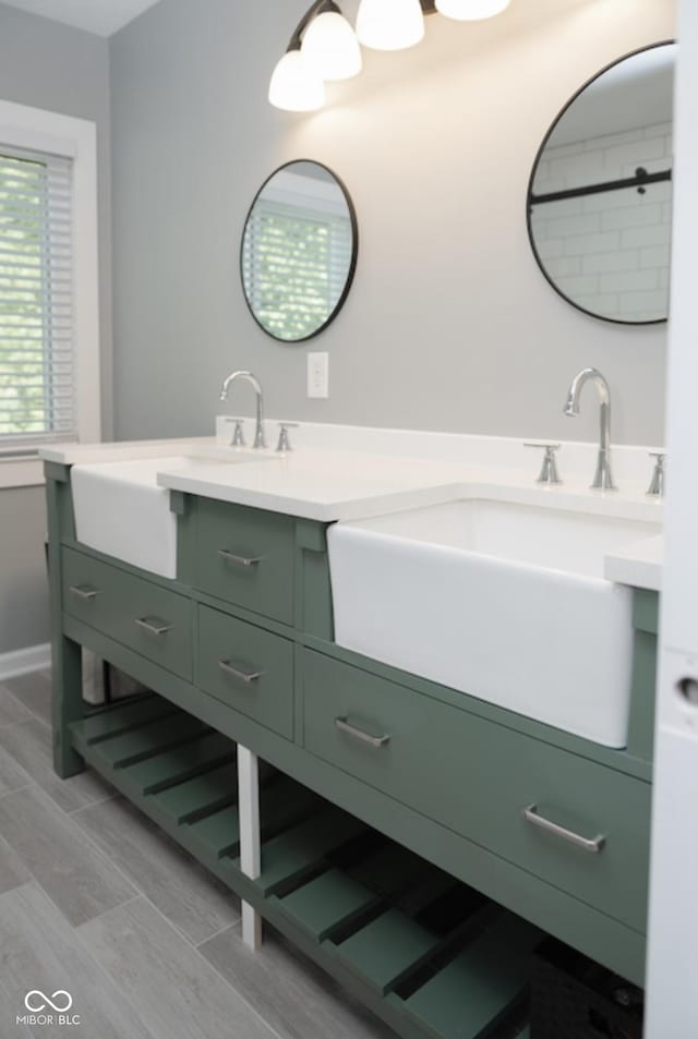 bathroom featuring double vanity and a sink