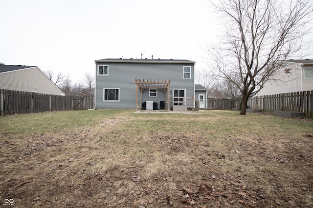 rear view of house with a fenced backyard, a yard, and a pergola