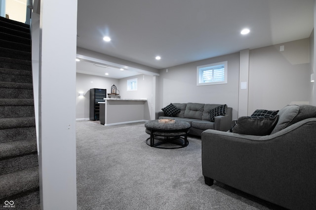 living room featuring carpet floors, stairway, and recessed lighting