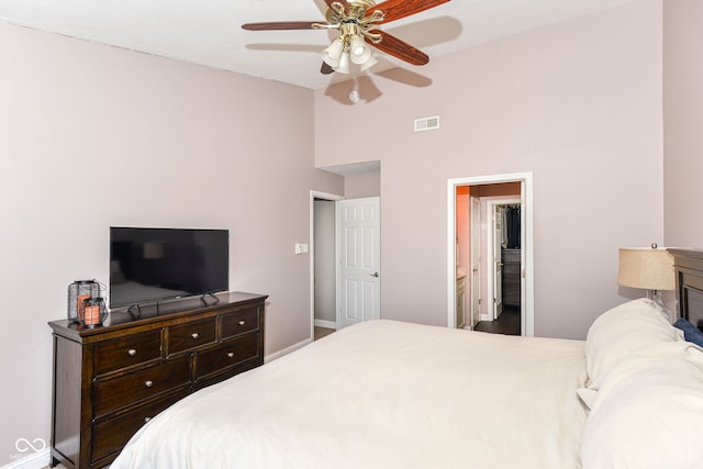 bedroom featuring lofted ceiling, ceiling fan, and visible vents