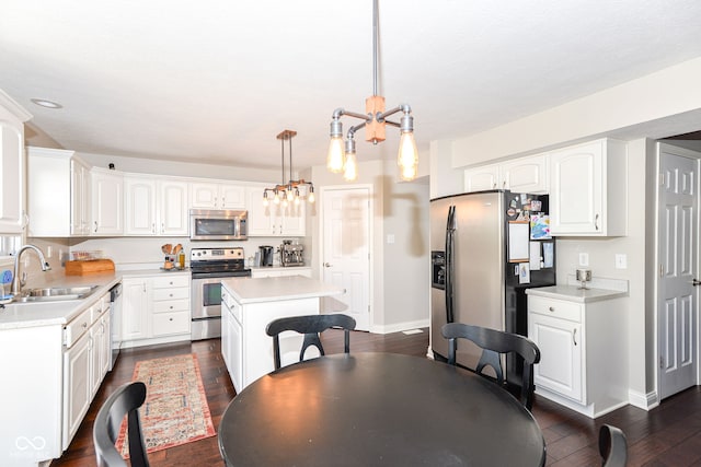 dining room with a chandelier, dark wood-style flooring, and baseboards