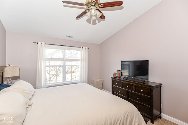 bedroom featuring lofted ceiling, light colored carpet, a ceiling fan, baseboards, and visible vents