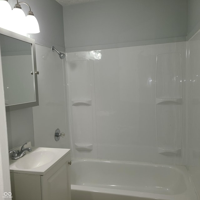 full bath featuring bathing tub / shower combination and vanity