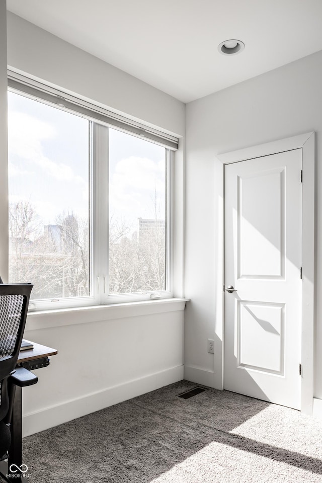 interior space featuring visible vents and baseboards