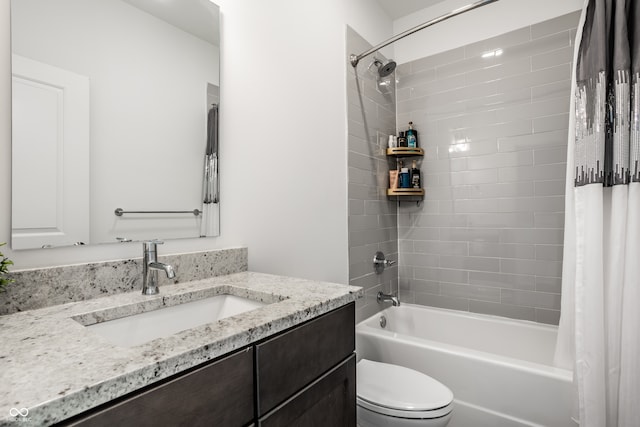 bathroom featuring shower / tub combo, vanity, and toilet