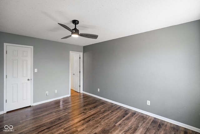 unfurnished bedroom with a ceiling fan, baseboards, and wood finished floors