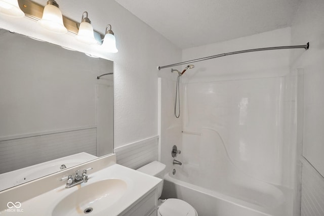 bathroom with shower / washtub combination, vanity, and toilet