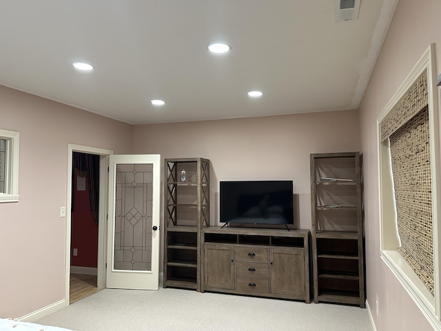 unfurnished living room with baseboards, visible vents, carpet flooring, and recessed lighting