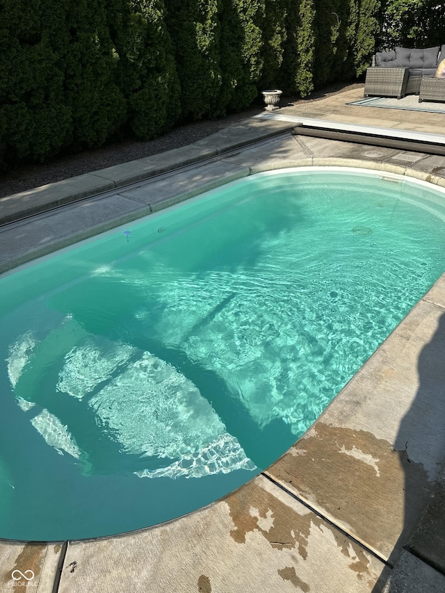 pool with a patio area