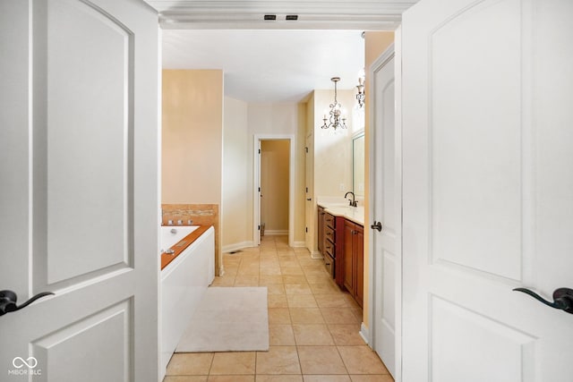 286 S Woodridge Dr, Pittsboro, IN 46167 - full bath with vanity, a garden tub, tile patterned flooring, and baseboards