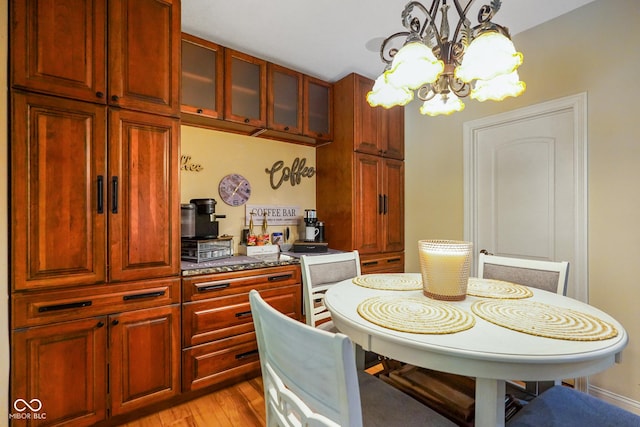 286 S Woodridge Dr, Pittsboro, IN 46167 - dining room with a chandelier and light wood finished floors