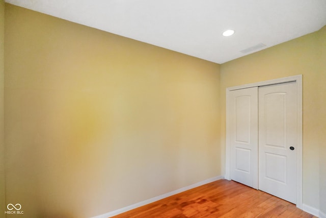 286 S Woodridge Dr, Pittsboro, IN 46167 - unfurnished bedroom with light wood-type flooring, baseboards, a closet, and recessed lighting
