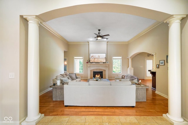 286 S Woodridge Dr, Pittsboro, IN 46167 - living area with ceiling fan, decorative columns, light wood-type flooring, and crown molding