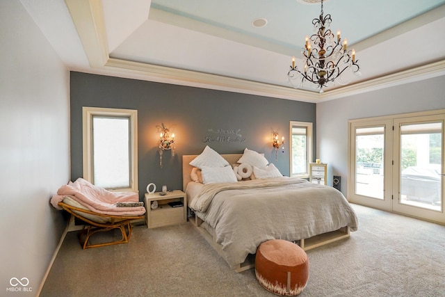 286 S Woodridge Dr, Pittsboro, IN 46167 - bedroom with a chandelier, a raised ceiling, access to outside, and carpet floors