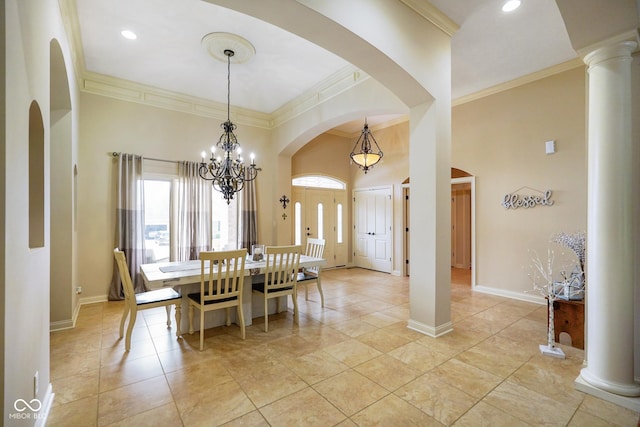 286 S Woodridge Dr, Pittsboro, IN 46167 - dining area with ornamental molding, a chandelier, a towering ceiling, baseboards, and decorative columns