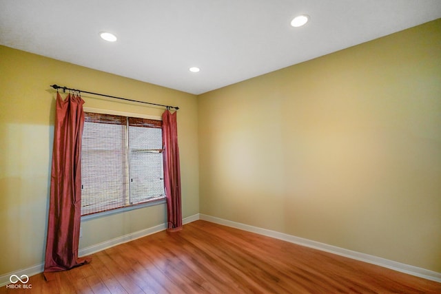 286 S Woodridge Dr, Pittsboro, IN 46167 - spare room featuring wood finished floors, baseboards, and recessed lighting