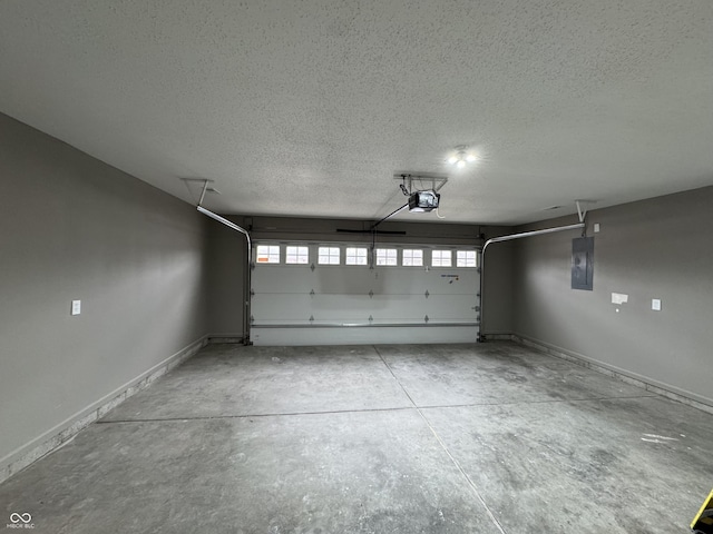 garage featuring electric panel, baseboards, and a garage door opener