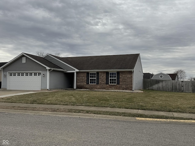 ranch-style house featuring brick siding, concrete driveway, an attached garage, a front yard, and fence