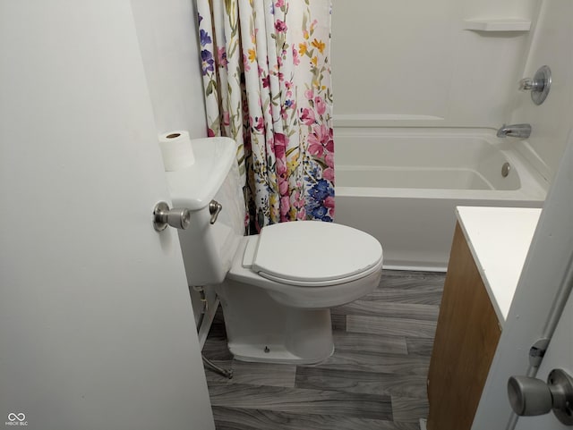 full bathroom featuring toilet, vanity, and shower / tub combo with curtain