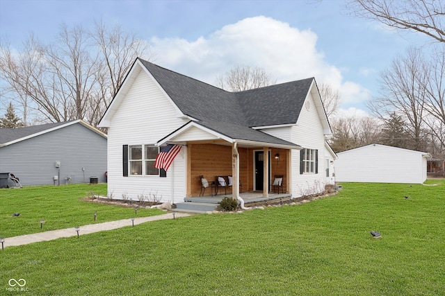 view of front of house featuring covered porch, a front lawn, and roof with shingles