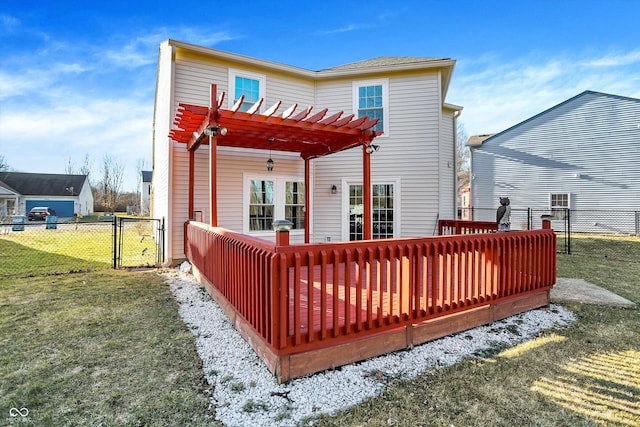 back of house with a yard, fence, a gate, and a pergola