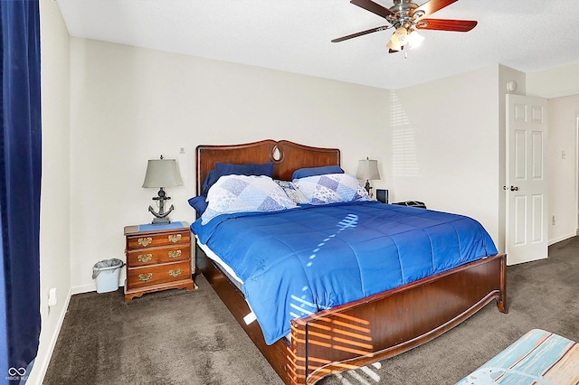 carpeted bedroom featuring a textured ceiling, baseboards, and a ceiling fan