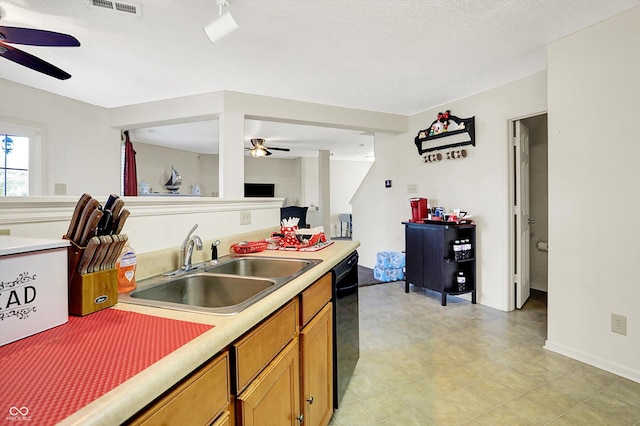 kitchen with brown cabinetry, dishwasher, a ceiling fan, light countertops, and a sink