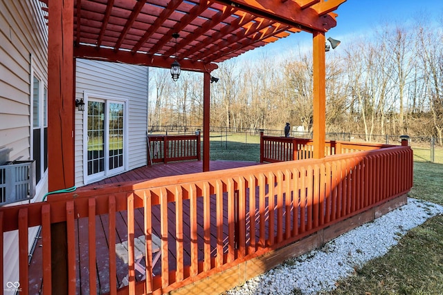 wooden terrace with fence, a pergola, and a yard