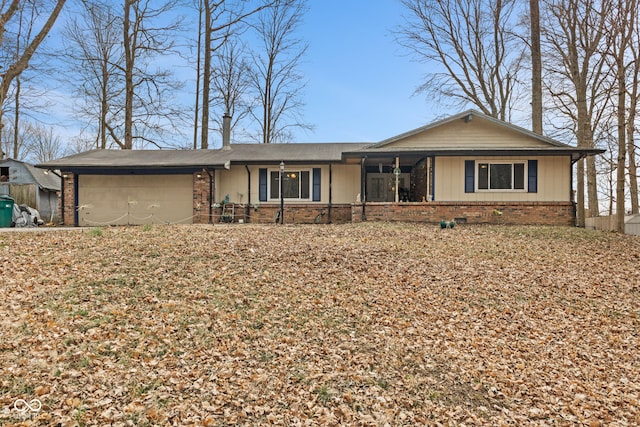 ranch-style home with crawl space, brick siding, and an attached garage