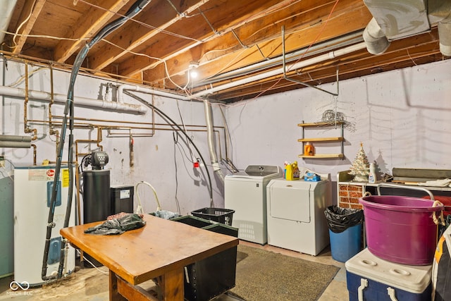 unfinished below grade area featuring gas water heater and washer and dryer