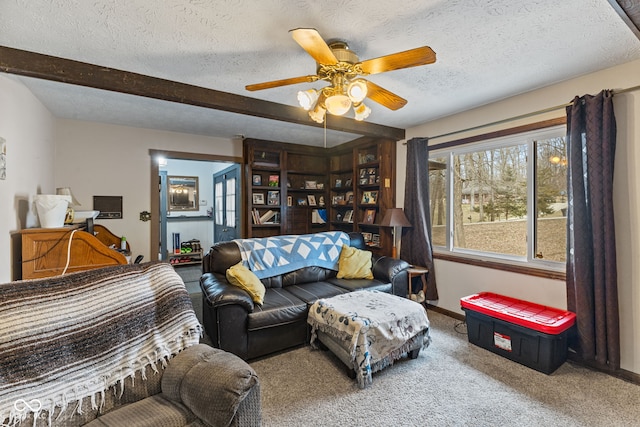 living room featuring a textured ceiling, baseboards, beamed ceiling, and carpet flooring