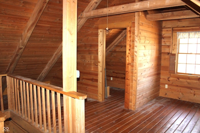 corridor with wood walls, wood ceiling, a sauna, beam ceiling, and dark wood finished floors