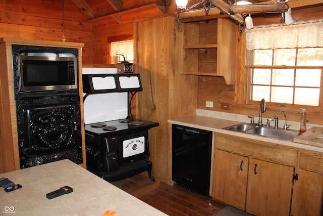 kitchen with wooden walls, dishwasher, stainless steel microwave, light countertops, and a sink