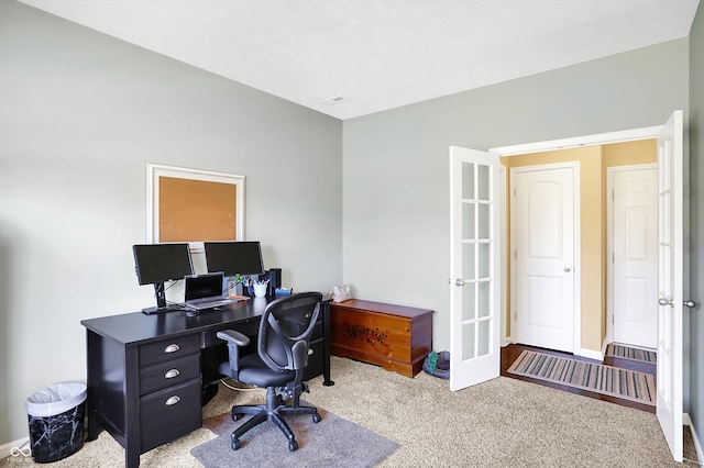 office space with carpet and baseboards