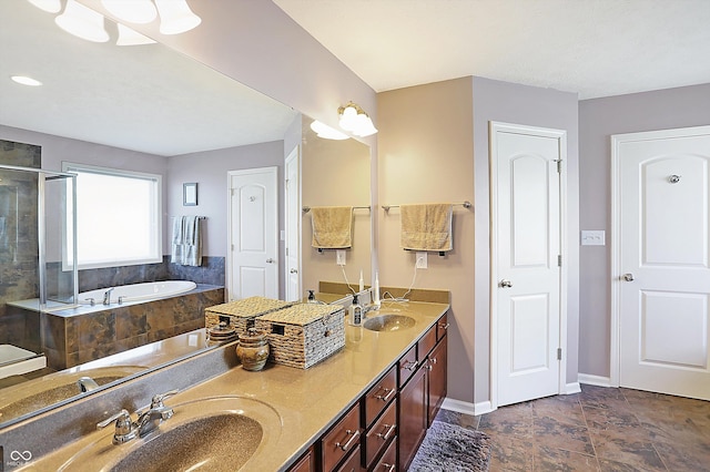 full bathroom with double vanity, a sink, a shower stall, and a bath