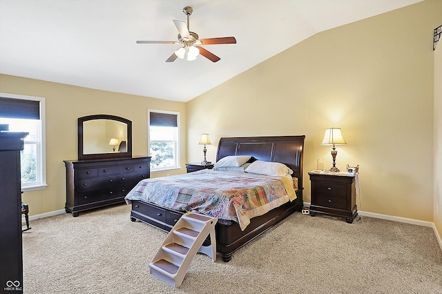 carpeted bedroom with lofted ceiling, baseboards, and a ceiling fan