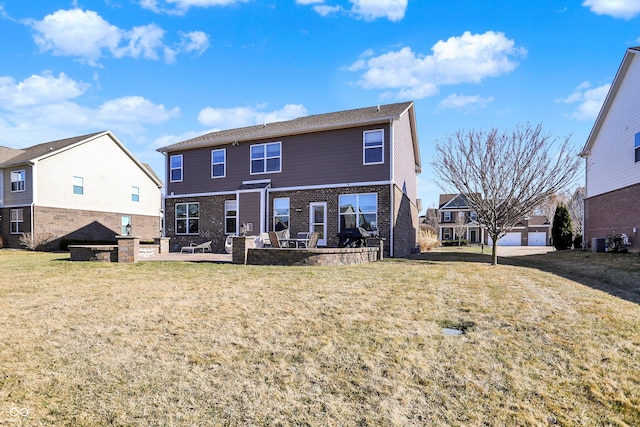 back of house with a yard, brick siding, a patio, and central AC unit