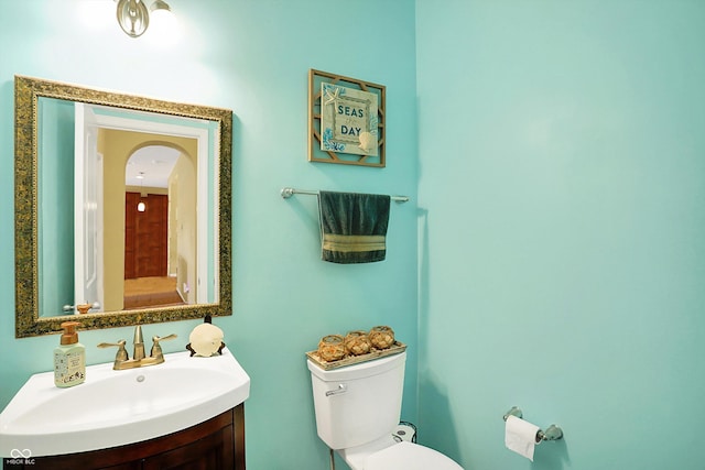 bathroom with vanity and toilet