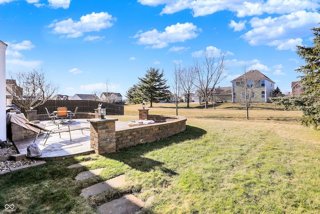 view of yard featuring a patio and fence