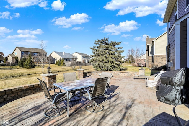 view of patio with a residential view and outdoor dining area